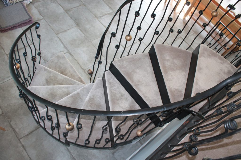 Wrought iron and stone curved staircase