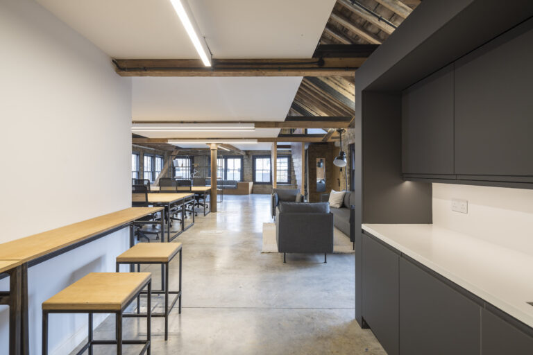 A bespoke breakfast bar with high level seating creates a welcome break-out space at London House, 115 Golden Lane post CAT A+ fit-out by Foster Projects, supported by Winthill Engineering