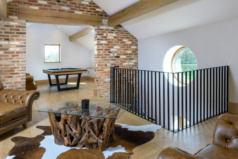 Custom steel balustrade and staircase designed by Winthill Engineering for a luxury party barn renovation in Shropshire